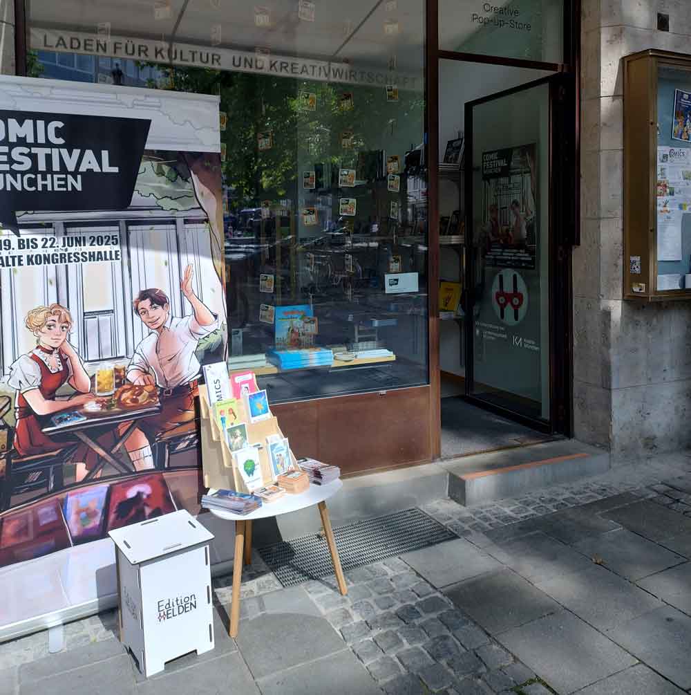 Wilkommen bei der Edition Helden 3 Popupstore mit Comics zu sehen ist der Eingang und das Schaufenster