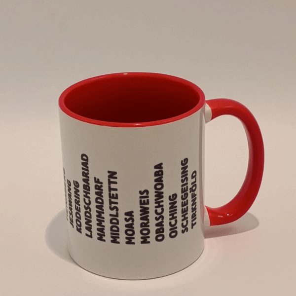 Rote Tasse mit den zum Landkreis Fürstenfeldbruck gehörenden Ortsnamen